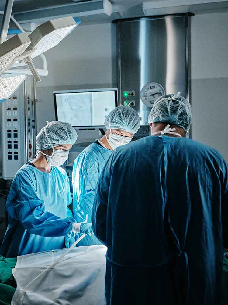 surgical techs helping in surgery